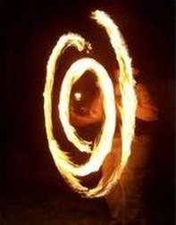 A friend of mine spinning fire poi